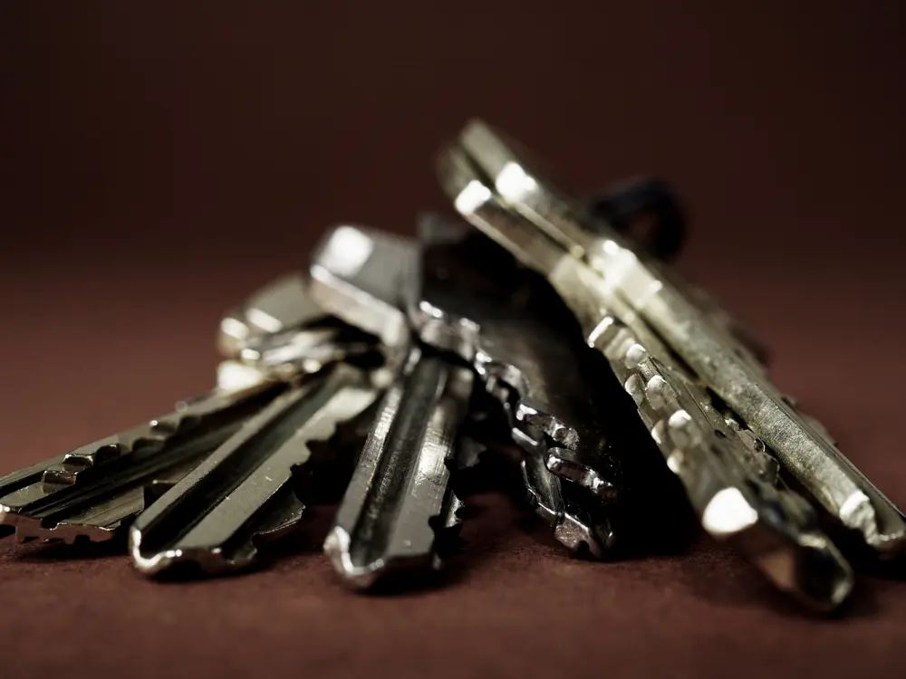 Pile of keys on a dark table