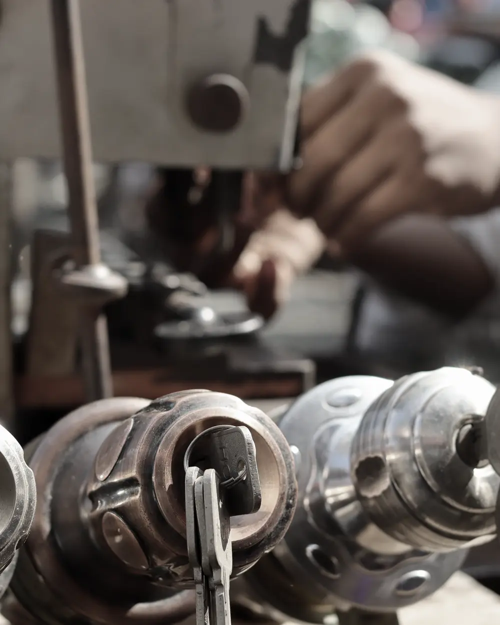 Key being cut on a key duplicating machine